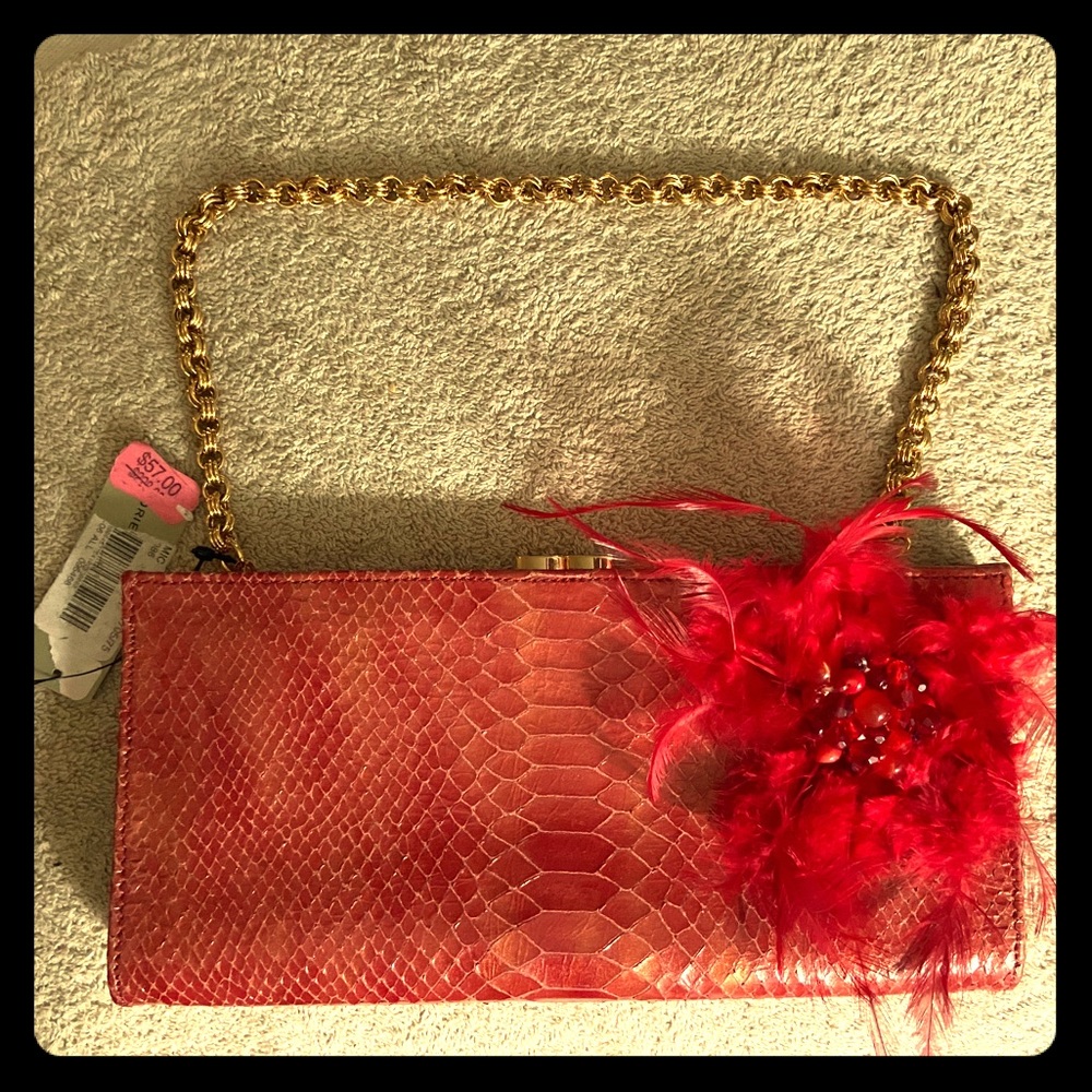 Snakeskin clutch with feather detail